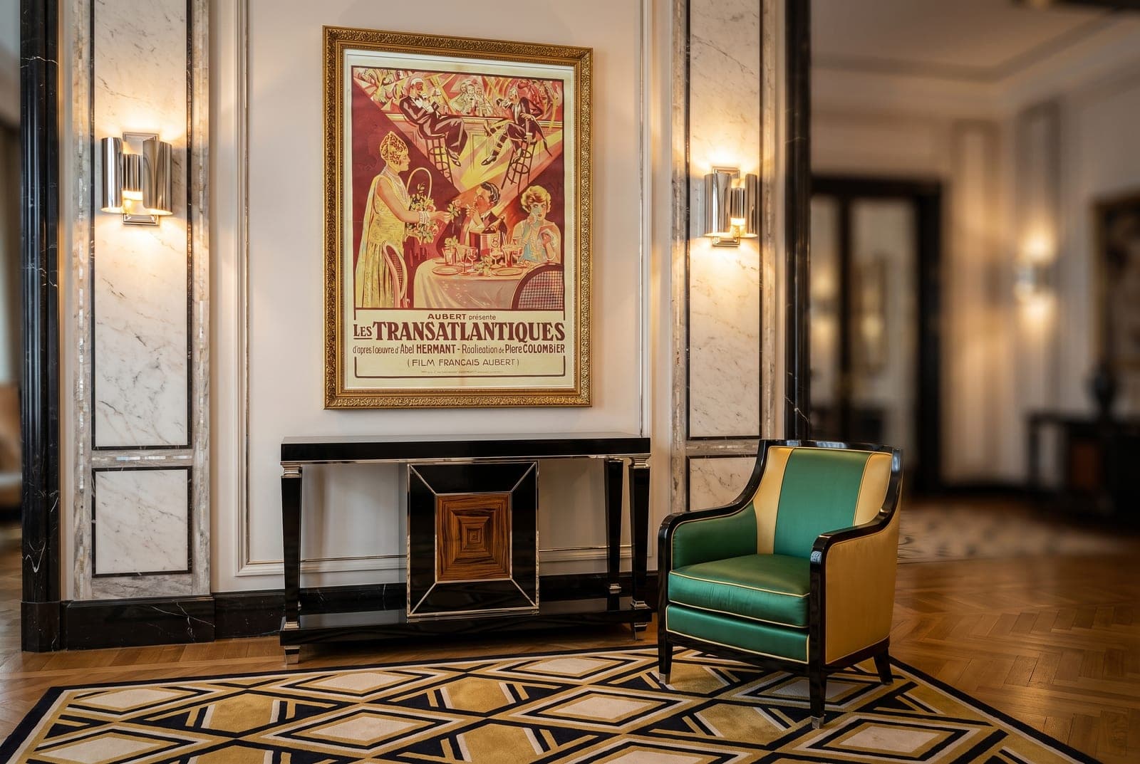 The Les Transatlantiques affiche reproduction, framed in an Art Deco Parisian salon