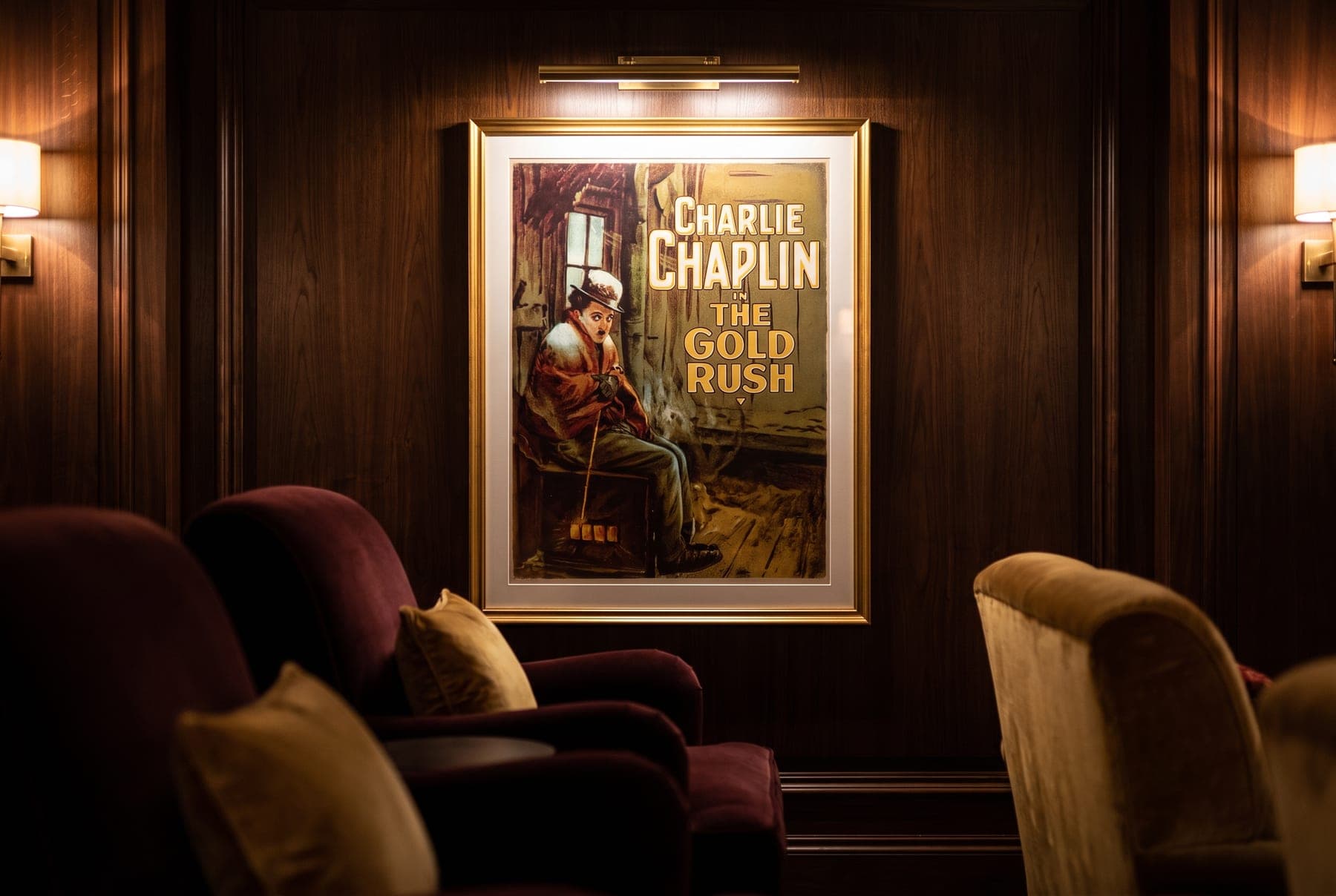The Gold Rush one-sheet reproduction, framed in an opulent private home cinema